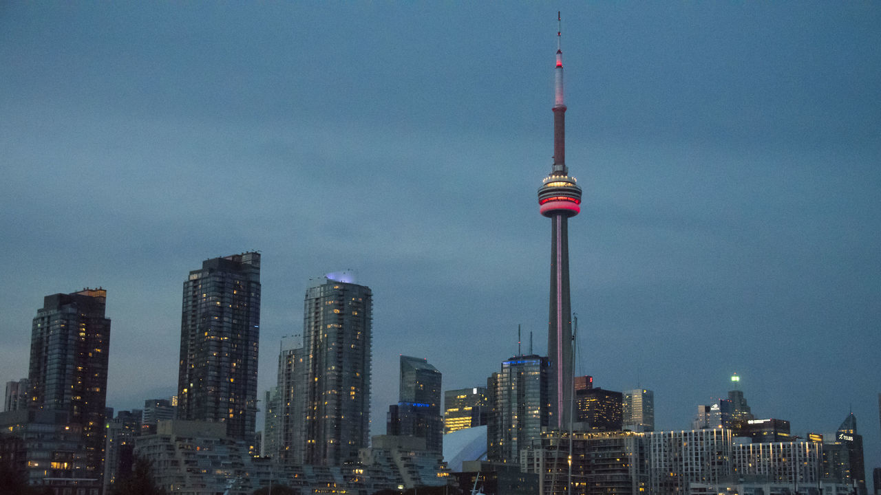 TORONTO, ONTARIO, CANADA - 2016/08/30: Toronto City at night. Urban skyline including the CN Tower. View from Lake Ontario.