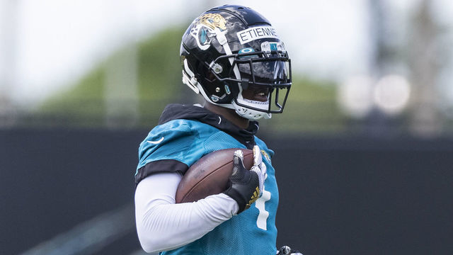 JACKSONVILLE, FLORIDA - JUNE 08: Travis Etienne #1 of the Jacksonville Jaguars looks on during Jacksonville Jaguars Training Camp at TIAA Bank Field on June 08, 2021 in Jacksonville, Florida.