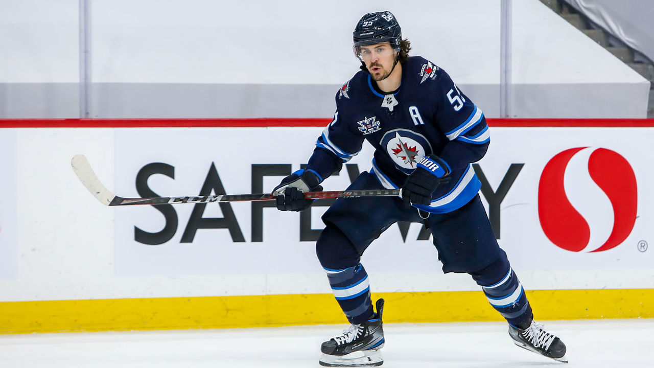 WINNIPEG, MB - JUNE 02: Mark Scheifele #55 of the Winnipeg Jets follows the puck up the ice during second period action against the Montreal Canadiens in Game One of the Second Round of the 2021 Stanley Cup Playoffs at Bell MTS Place on June 02, 2021 in Winnipeg, Manitoba, Canada.