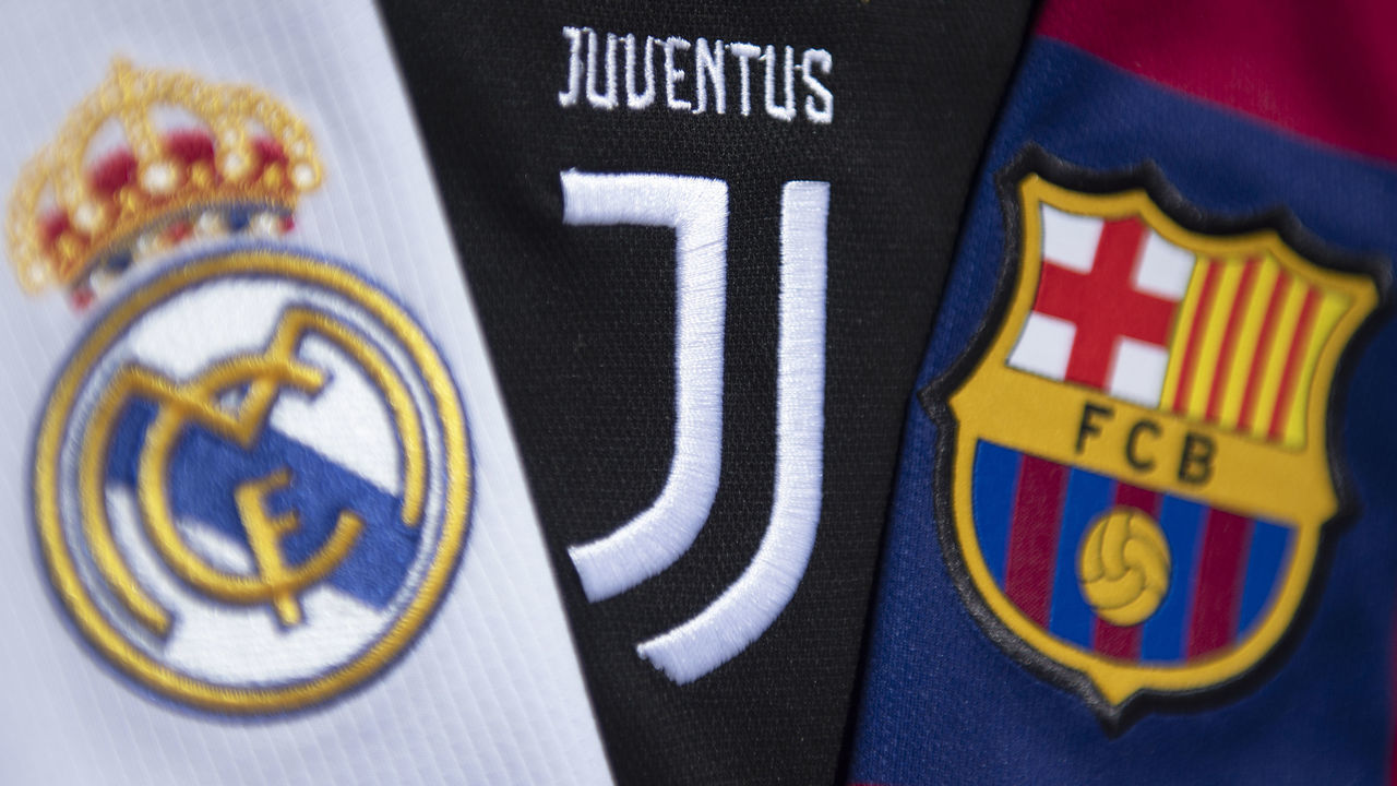 MANCHESTER, ENGLAND - MAY 10: The club badges of the three remaining clubs in the European Super League Real Madrid, Juventus and Barcelona on their first team home shirts on May 10, 2021 in Manchester, United Kingdom.
