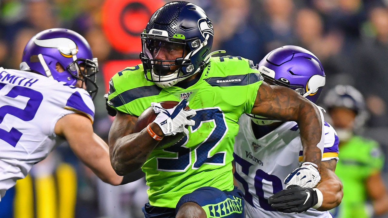 SEATTLE, WASHINGTON - DECEMBER 02: Chris Carson #32 of the Seattle Seahawks high steps his way to more yard during the game against the Minnesota Vikings at CenturyLink Field on December 02, 2019 in Seattle, Washington. The Seattle Seahawks won, 37-30.