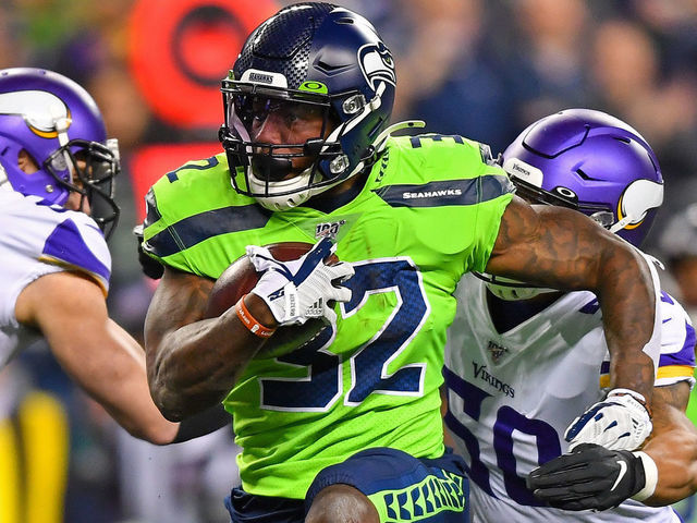 SEATTLE, WASHINGTON - DECEMBER 02: Chris Carson #32 of the Seattle Seahawks high steps his way to more yard during the game against the Minnesota Vikings at CenturyLink Field on December 02, 2019 in Seattle, Washington. The Seattle Seahawks won, 37-30.