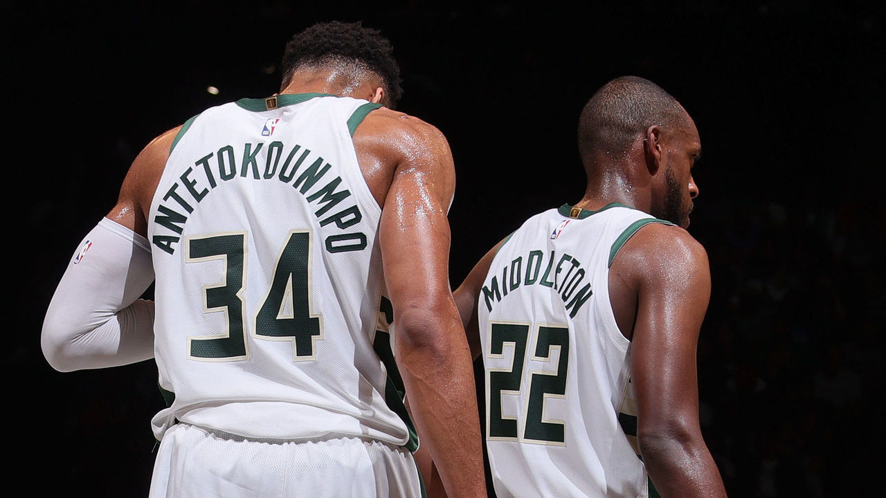 BROOKLYN, NY - JUNE 7: Giannis Antetokounmpo #34 and Khris Middleton #22 of the Milwaukee Bucks look on during Round 2, Game 2 of the 2021 NBA Playoffs on June 7, 2021 at Barclays Center in Brooklyn, New York. Mandatory Copyright Notice: Copyright 2021 NBAE