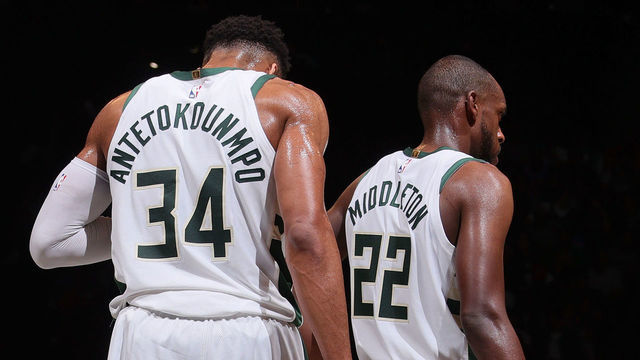 BROOKLYN, NY - JUNE 7: Giannis Antetokounmpo #34 and Khris Middleton #22 of the Milwaukee Bucks look on during Round 2, Game 2 of the 2021 NBA Playoffs on June 7, 2021 at Barclays Center in Brooklyn, New York. Mandatory Copyright Notice: Copyright 2021 NBAE