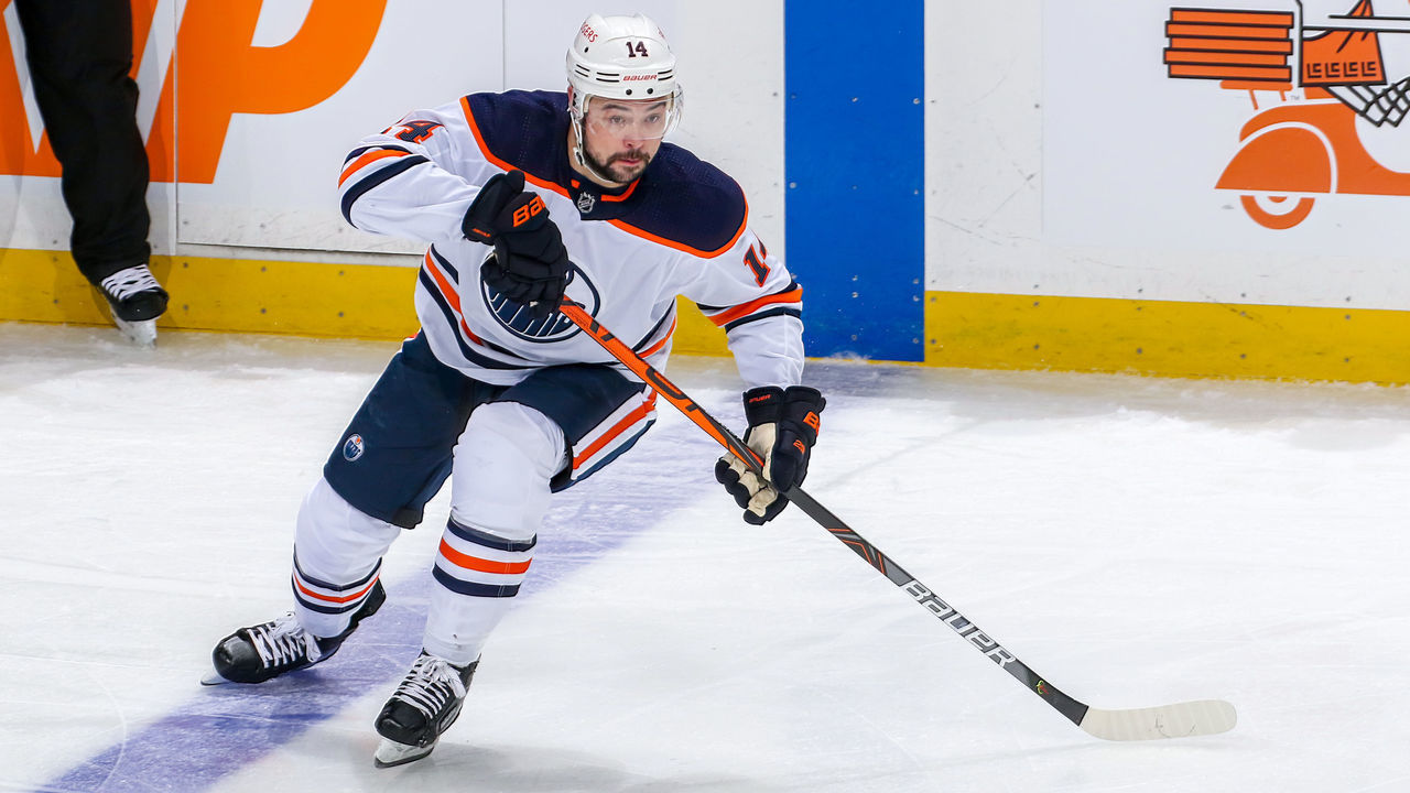 WINNIPEG, MB - MAY 24: Devin Shore #14 of the Edmonton Oilers keeps an eye on the play during first period action against the Winnipeg Jets in Game Four of the First Round of the 2021 Stanley Cup Playoffs at Bell MTS Place on May 24, 2021 in Winnipeg, Manitoba.