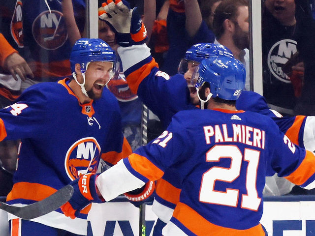 UNIONDALE, NEW YORK - JUNE 09: Travis Zajac #14 of the New York Islanders (L) celebrates his first period goal against the Boston Bruins in Game Six of the Second Round of the 2021 NHL Stanley Cup Playoffs at the Nassau Coliseum on June 09, 2021 in Uniondale, New York.