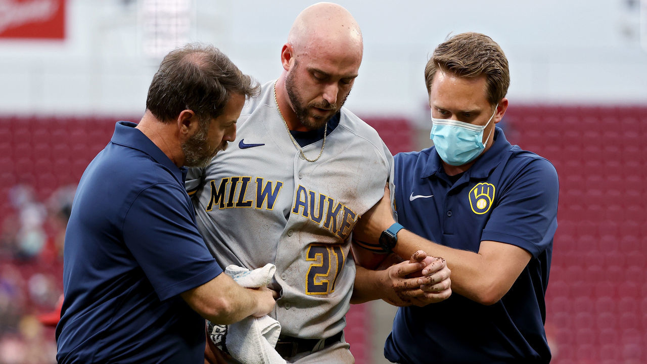 CINCINNATI, OHIO - JUNE 09: Travis Shaw #21 of the Milwaukee Brewers leaves the game after being injured in the second inning against the Cincinnati Reds at Great American Ball Park on June 09, 2021 in Cincinnati, Ohio.