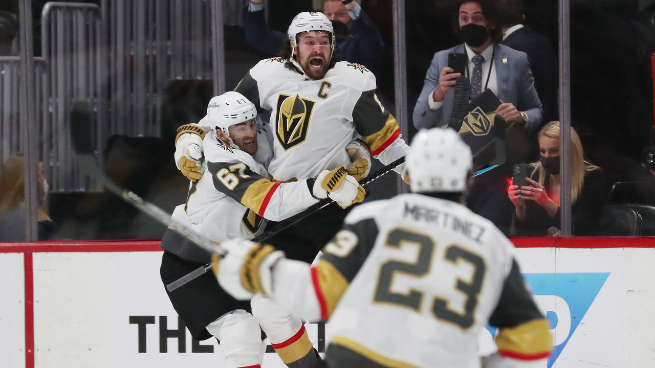 DENVER, COLORADO - JUNE 08: Mark Stone #61 of the Vegas Golden Knights celebrates a game-winning goal against the Colorado Avalanche in Game Five of the Second Round of the 2021 Stanley Cup Playoffs with teammate Max Pacioretty #67 at Ball Arena on June 8, 2021 in Denver, Colorado. The Golden Knights defeated the Avalanche 3-2 in overtime.