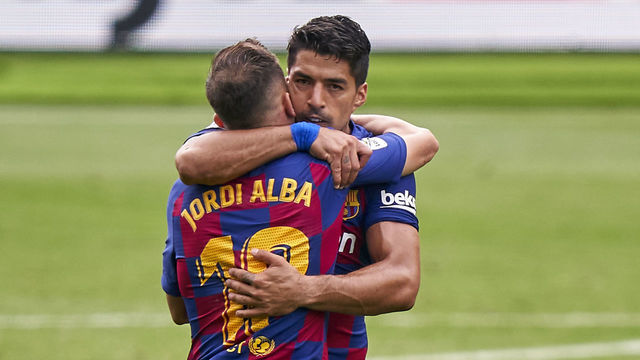 VIGO, SPAIN - JUNE 27: Luis Suarez of FC Barcelona celebrates with Jordi Alba after scoring his team's second goal during the Liga match between RC Celta de Vigo and FC Barcelona at Abanca-Balaídos on June 27, 2020 in Vigo, Spain.