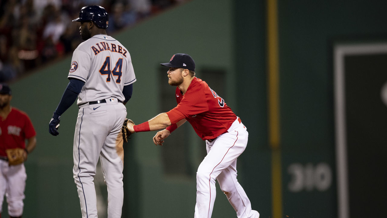 BOSTON, MA - JUNE 10: Christian Arroyo #39 of the Boston Red Sox tags out Yordan Alvarez #44 of theHouston Astros during the seventh inning of a game on June 10, 2021 at Fenway Park in Boston, Massachusetts.