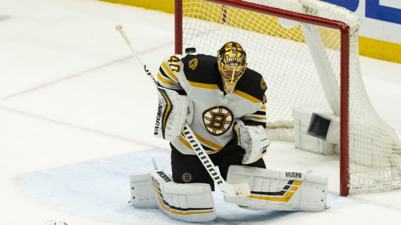 UNIONDALE, NY - JUNE 09: Boston Bruins Goalie Tuukka Rask (40) deflects the puck making a save during the third period of Game 6 of the NHL Stanley Cup Playoffs Second Round between the Boston Bruins and the New York Islanders on June 9, 2021, at the Nassau Veterans Memorial Coliseum in Uniondale, NY.