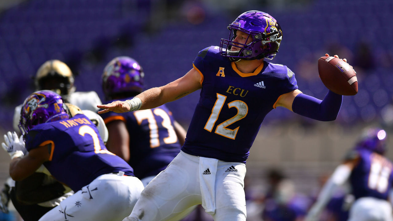 GREENVILLE, NC - SEPTEMBER 26: Holton Ahlers #12 of the East Carolina Pirates makes a pass against the UCF Knights on September 26, 2020 at Dowdy-Ficklen Stadium in Greenville, North Carolina.