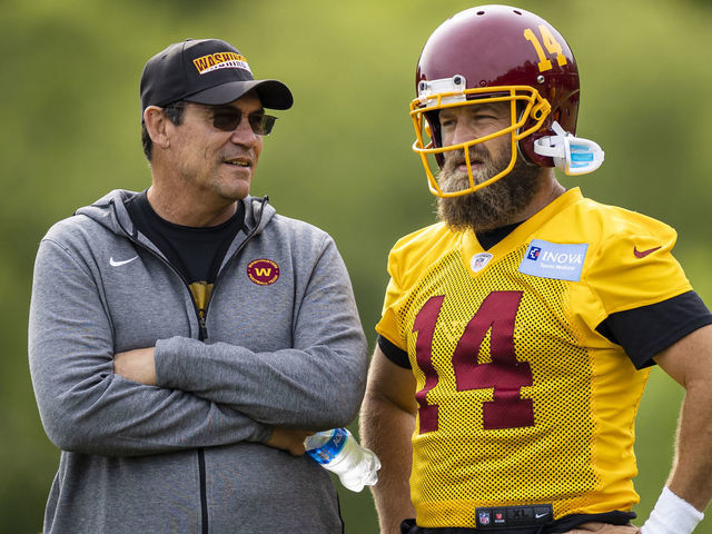 ASHBURN, VA - JUNE 02: Head coach Ron Rivera of the Washington Football Team speaks with Ryan Fitzpatrick #14 during the organized team activity at Inova Sports Performance Center on June 2, 2021 in Ashburn, Virginia.