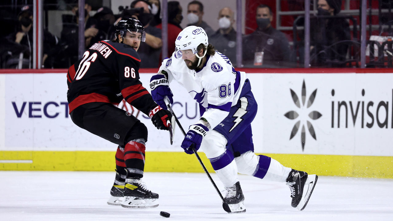 RALEIGH, NC - JUNE 8: Nikita Kucherov #86 of the Tampa Bay Lightning moves the puck as Teuvo Teravainen #86 defends in Game Five of the Second Round of the 2021 Stanley Cup Playoffs on June 8, 2021 at PNC Arena in Raleigh, North Carolina.