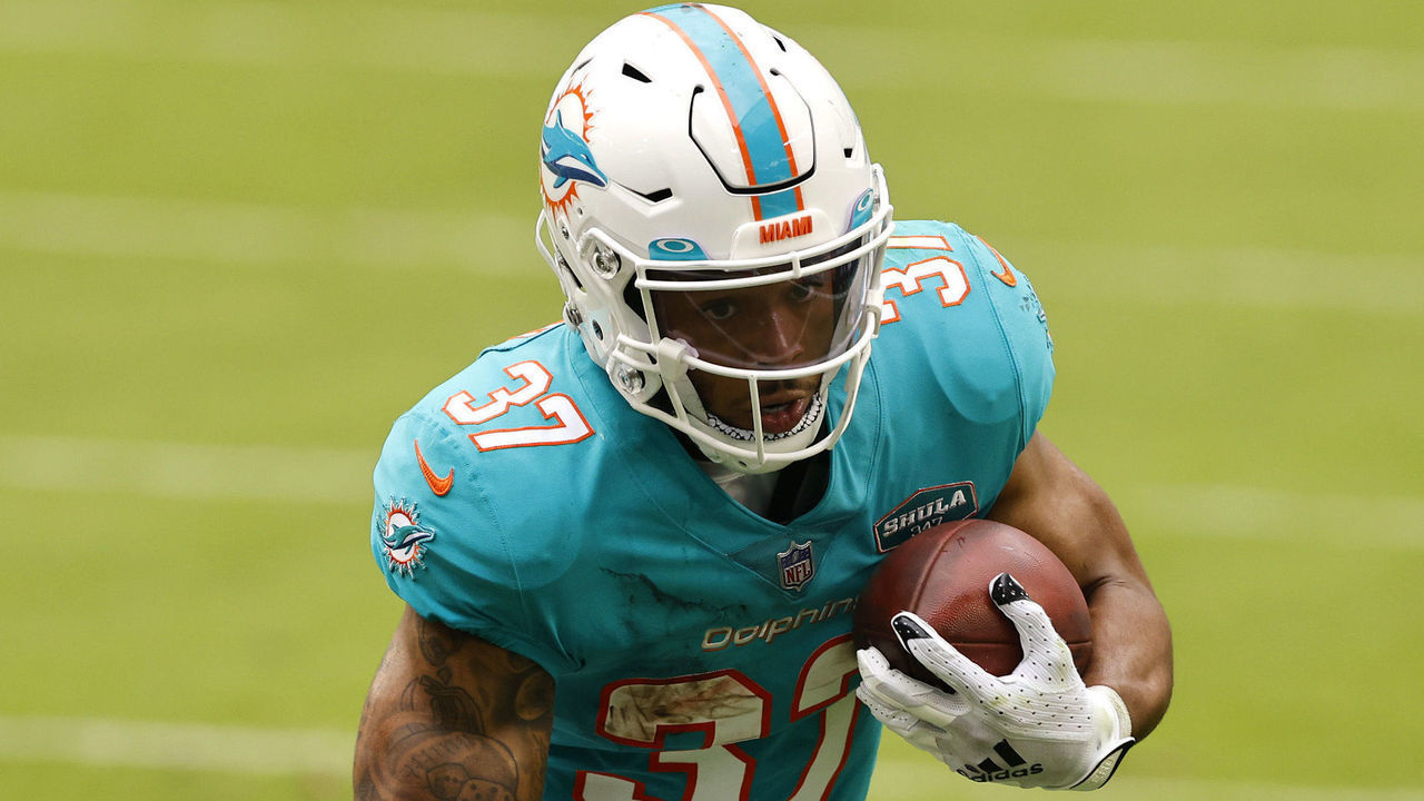 MIAMI GARDENS, FLORIDA - DECEMBER 06: Running back Myles Gaskin #37 of the Miami Dolphins runs with the ball in the first half of the game against the Cincinnati Bengals at Hard Rock Stadium on December 06, 2020 in Miami Gardens, Florida.