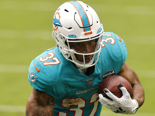 MIAMI GARDENS, FLORIDA - DECEMBER 06: Running back Myles Gaskin #37 of the Miami Dolphins runs with the ball in the first half of the game against the Cincinnati Bengals at Hard Rock Stadium on December 06, 2020 in Miami Gardens, Florida.