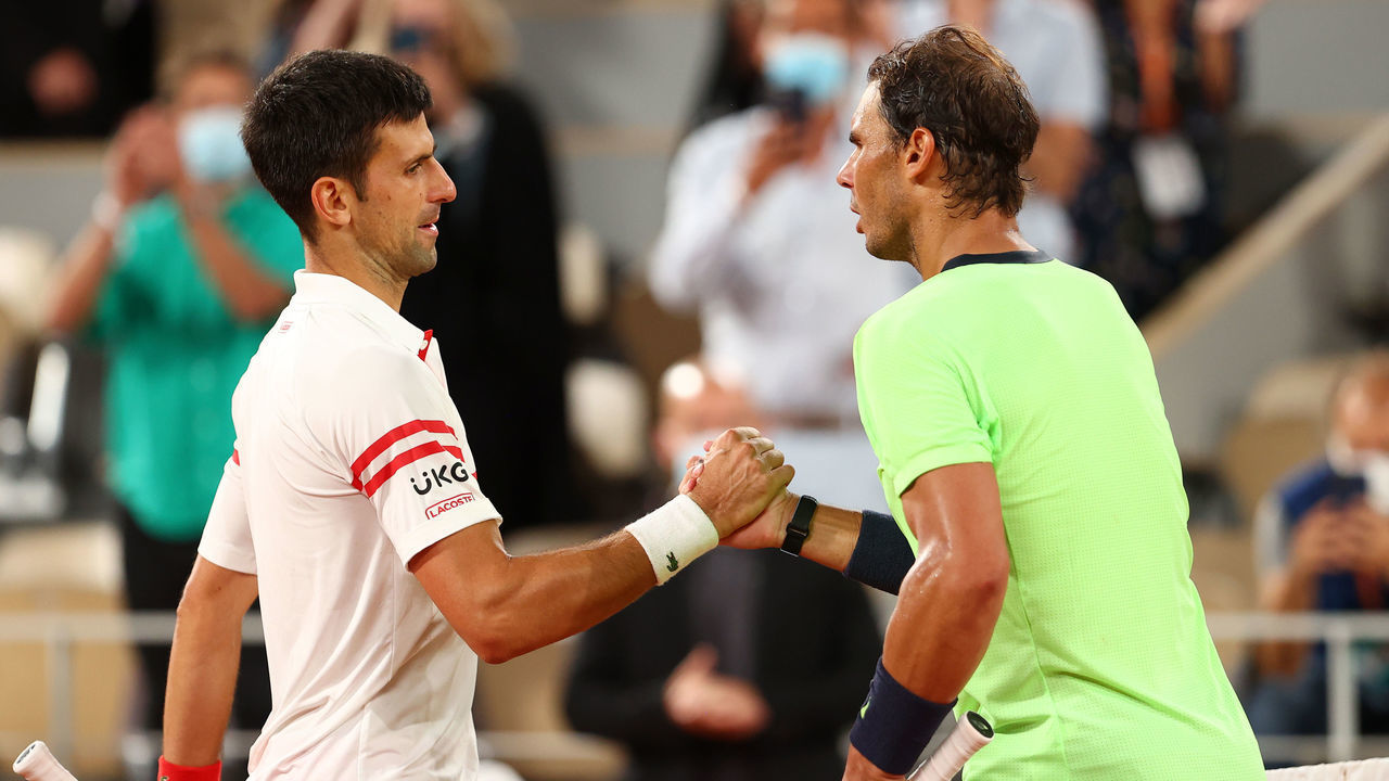 PARIS, FRANCE - JUNE 11: Novak Djokovic of Serbia (L) shakes hands with Rafael Nadal of Spain after winning their Men's Singles Semi Final match against on day Thirteen of the 2021 French Open at Roland Garros on June 11, 2021 in Paris, France.