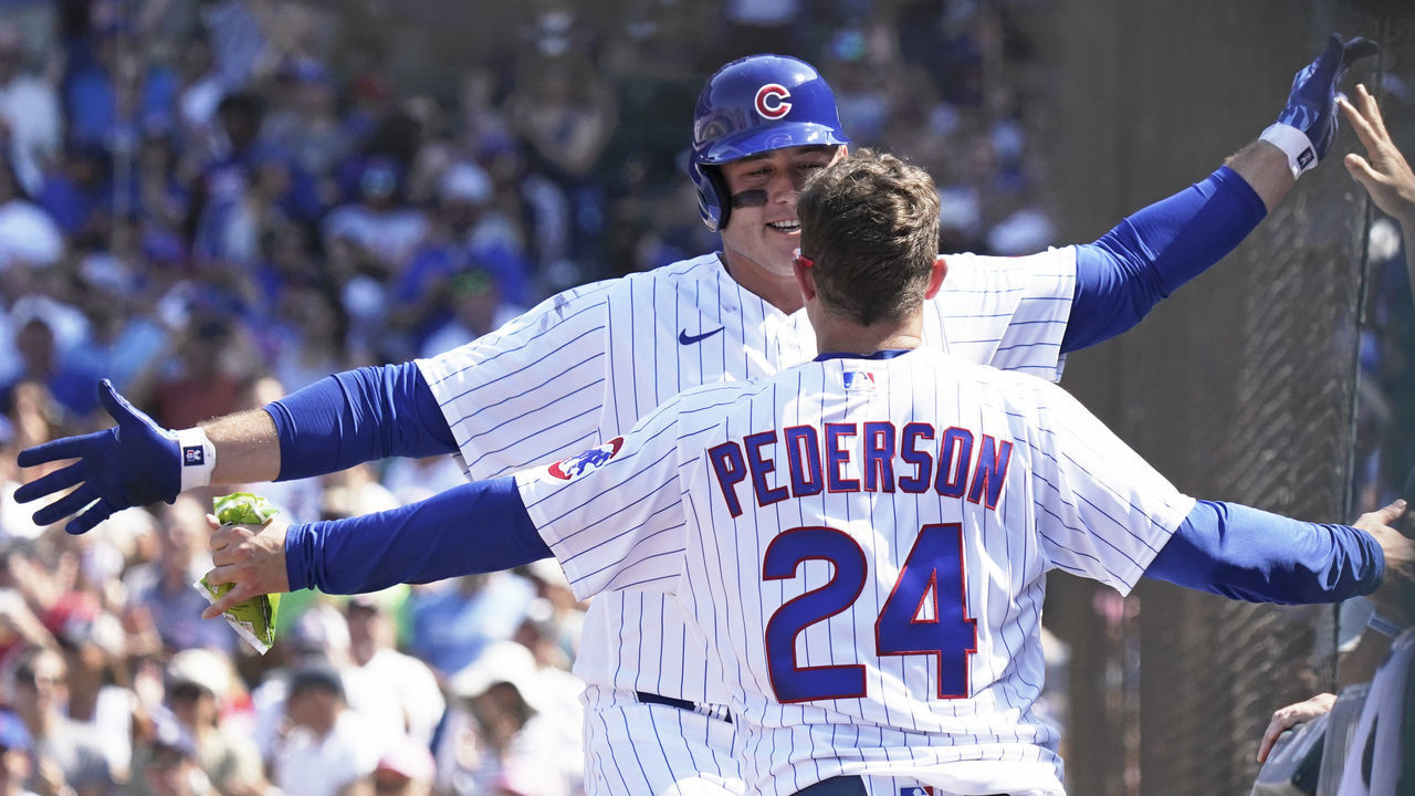 CHICAGO, ILLINOIS - JUNE 11: Anthony Rizzo #44 of the Chicago Cubs is congratulated by Joc Pederson #24 after his home run during the sixth inning of a game against the St. Louis Cardinals at Wrigley Field on June 11, 2021 in Chicago, Illinois.