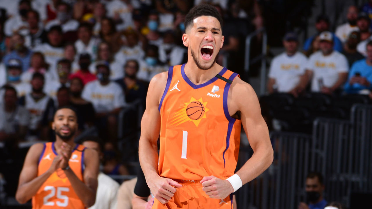 DENVER, CO - JUNE 11: Devin Booker #1 of the Phoenix Suns celebrates during the game against the Denver Nuggets during Round 2, Game 3 of the 2021 NBA Playoffs on June 11, 2021 at the Ball Arena in Denver, Colorado. NOTE TO USER: User expressly acknowledges and agrees that, by downloading and/or using this Photograph, user is consenting to the terms and conditions of the Getty Images License Agreement. Mandatory Copyright Notice: Copyright 2021 NBAE
