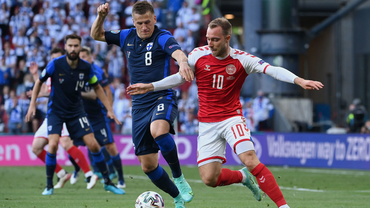 COPENHAGEN, DENMARK - JUNE 12: Christian Eriksen of Denmark battles for possession with Robin Lod of Finland during the UEFA Euro 2020 Championship Group B match between Denmark and Finland on June 12, 2021 in Copenhagen, Denmark.