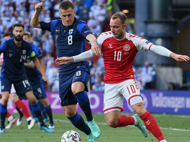 COPENHAGEN, DENMARK - JUNE 12: Christian Eriksen of Denmark battles for possession with Robin Lod of Finland during the UEFA Euro 2020 Championship Group B match between Denmark and Finland on June 12, 2021 in Copenhagen, Denmark.