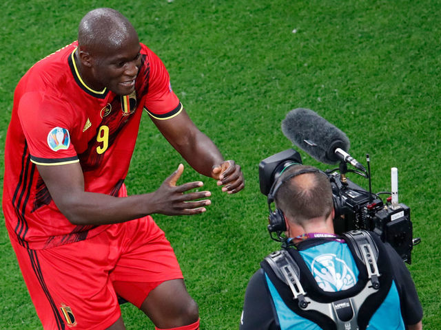 Belgium's forward Romelu Lukaku (L) celebrates in front of a camera after scoring his team's first goal during the UEFA EURO 2020 Group B football match between Belgium and Russia at the Saint Petersburg Stadium in Saint Petersburg on June 12, 2021.