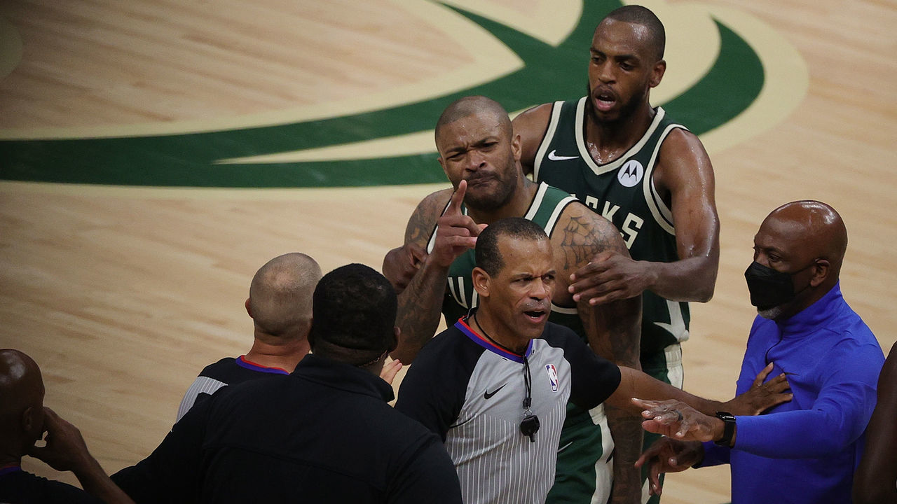 MILWAUKEE, WISCONSIN - JUNE 10: P.J. Tucker #17 of the Milwaukee Bucks is held back by Khris Middleton #22 during an altercation with Kevin Durant #7 of the Brooklyn Nets in the second half of Game Three of the Eastern Conference second round playoff series at the Fiserv Forum on June 10, 2021 in Milwaukee, Wisconsin.
