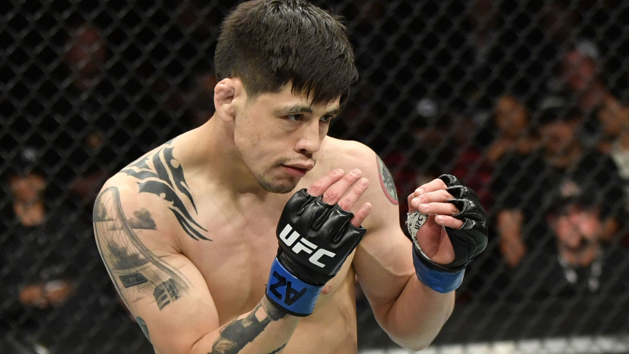 GLENDALE, ARIZONA - JUNE 12: Brandon Moreno of Mexico battles Deiveson Figueiredo of Brazil in their UFC flyweight championship fight during the UFC 263 event at Gila River Arena on June 12, 2021 in Glendale, Arizona.