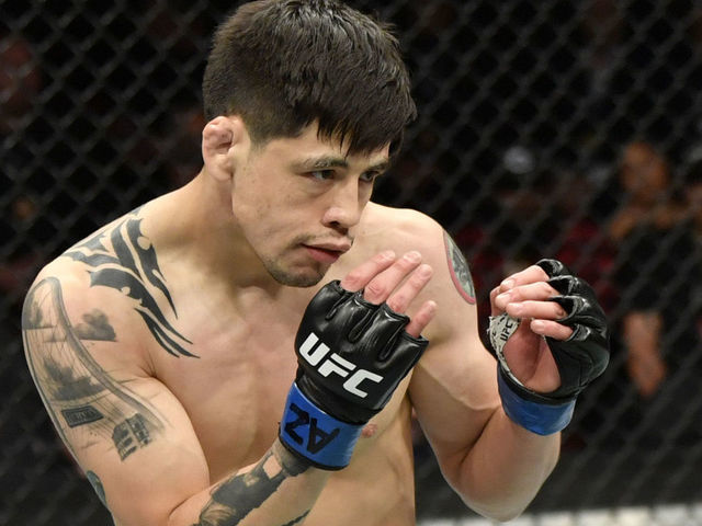GLENDALE, ARIZONA - JUNE 12: Brandon Moreno of Mexico battles Deiveson Figueiredo of Brazil in their UFC flyweight championship fight during the UFC 263 event at Gila River Arena on June 12, 2021 in Glendale, Arizona.