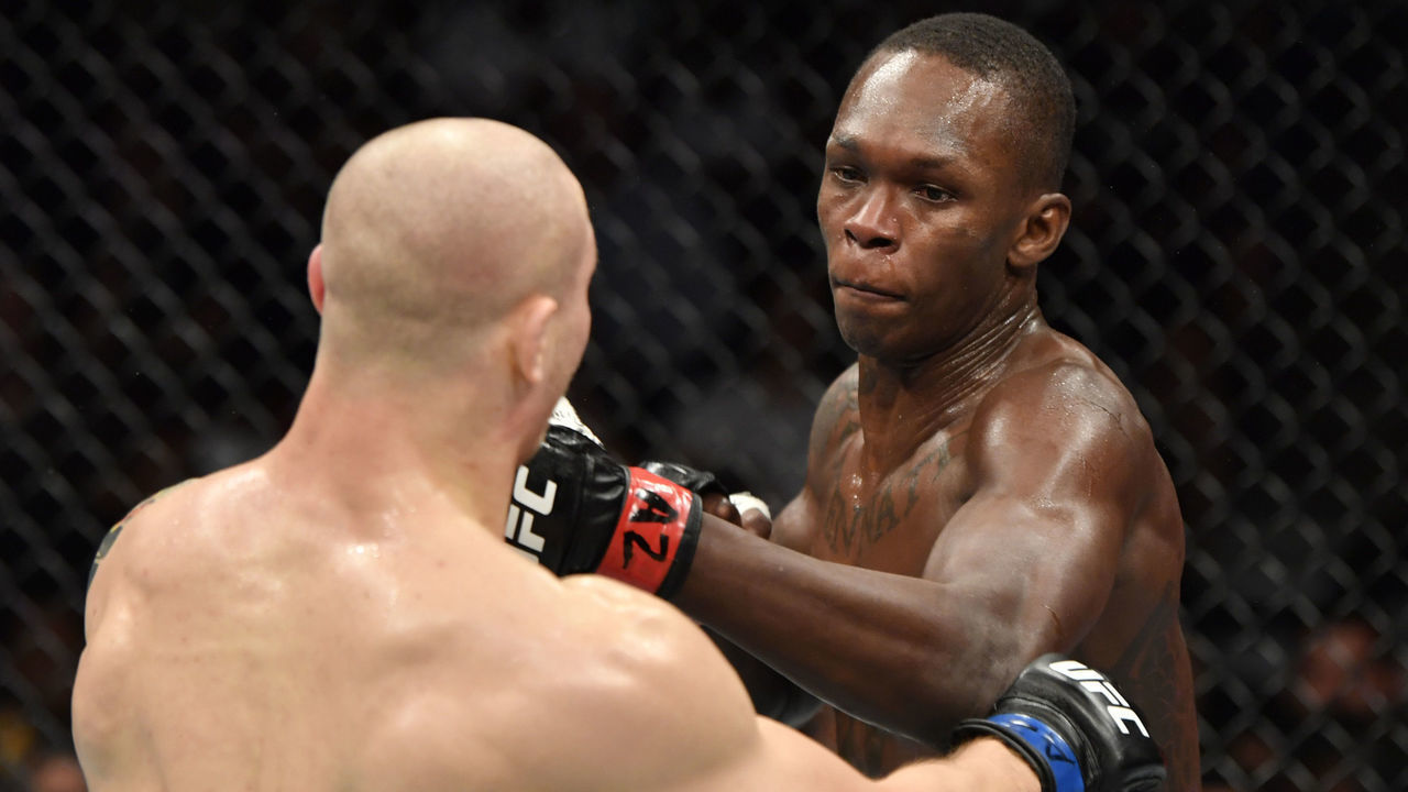 GLENDALE, ARIZONA - JUNE 12: (R-L) Israel Adesanya of Nigeria punches Marvin Vettori of Italy in their UFC middleweight championship fight during the UFC 263 event at Gila River Arena on June 12, 2021 in Glendale, Arizona.