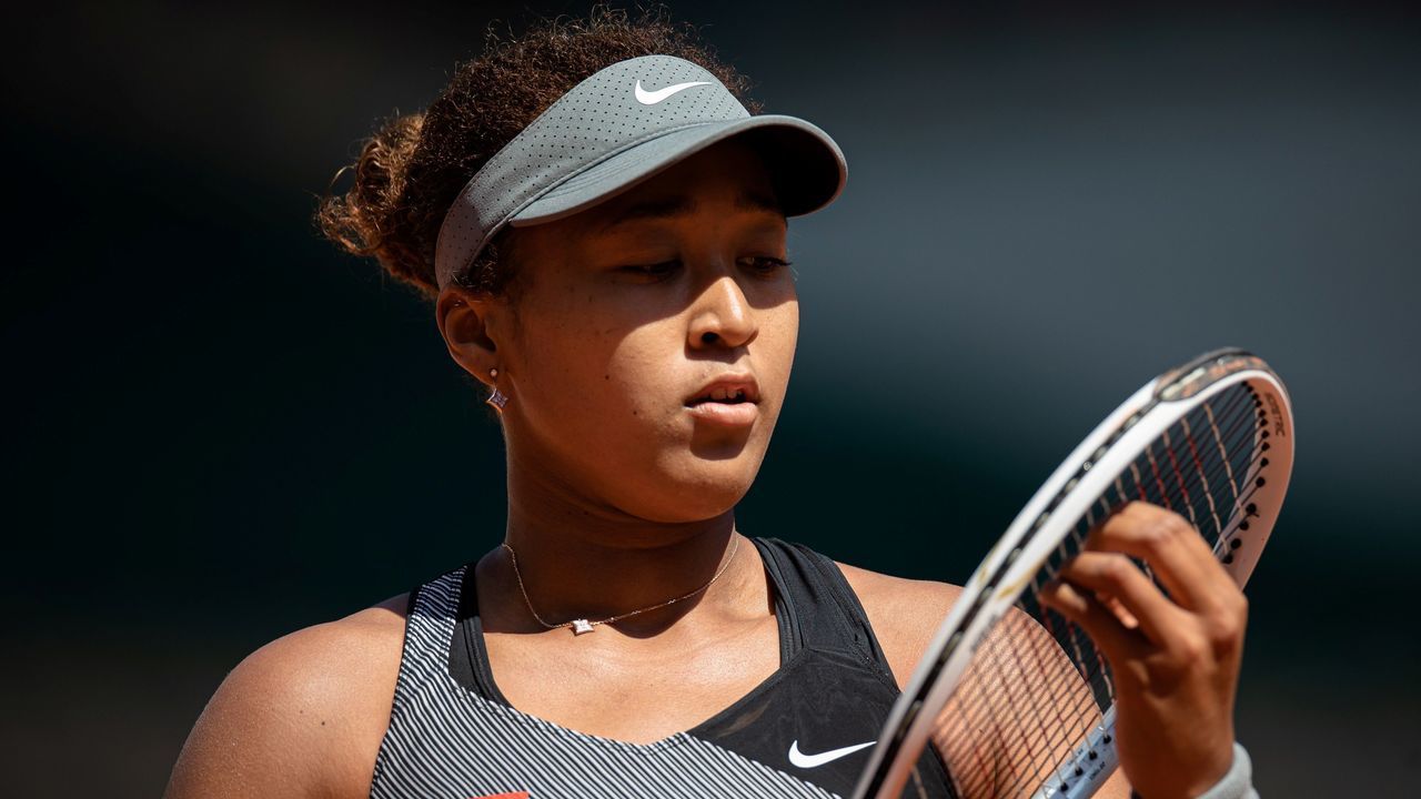Osaka Naomi of Japan reacts during the women's singles first round match against Patricia Maria Tig of Romania at the French Open tennis tournament at Roland Garros in Paris, France, May 30, 2021.