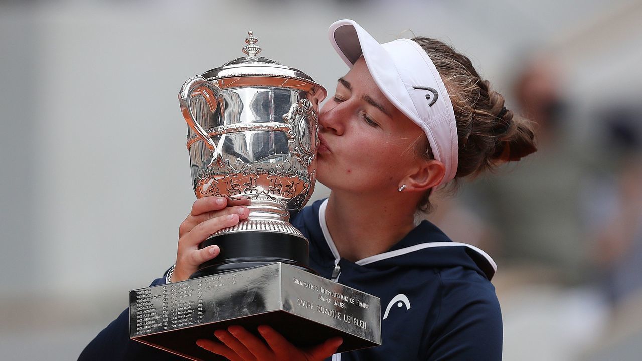 Barbora Krejcikova of the Czech Republic kisses the trophy after the women's singles final match between Anastasia Pavlyuchenkova of Russia and Barbora Krejcikova of the Czech Republic at the French Open tennis tournament at Roland Garros in Paris, France, June 12, 2021.