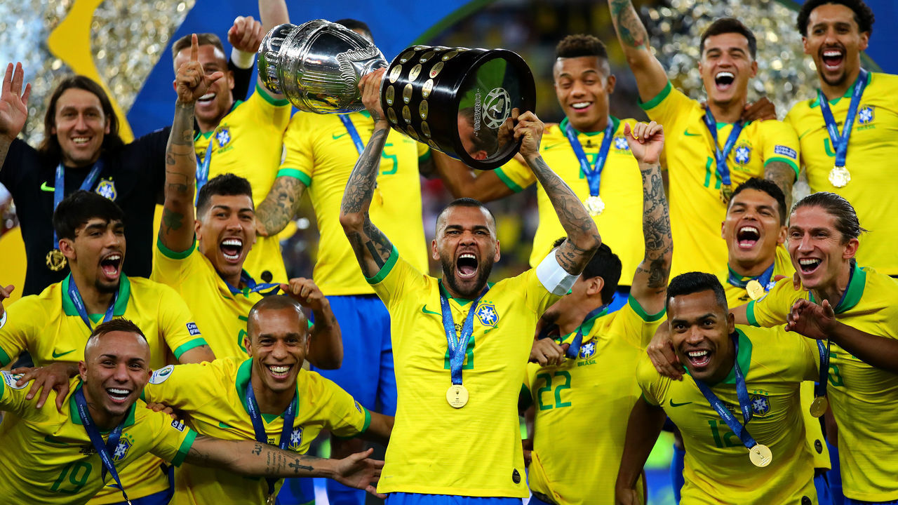 RIO DE JANEIRO, BRAZIL - JULY 07: Dani Alves of Brazil lifts the trophy following the Copa America Brazil 2019 Final match between Brazil and Peru at Maracana Stadium on July 07, 2019 in Rio de Janeiro, Brazil.