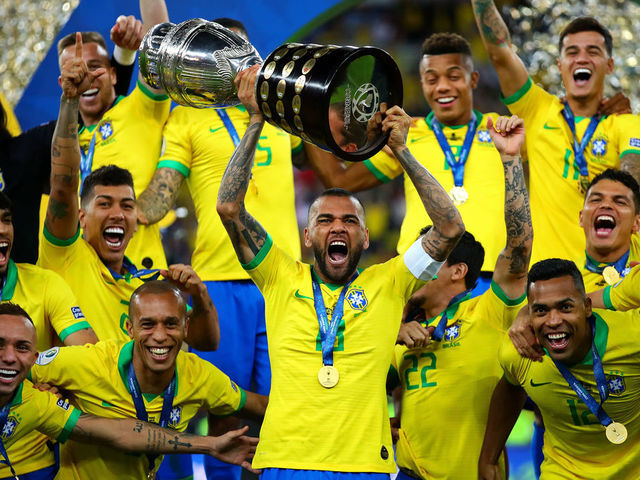 RIO DE JANEIRO, BRAZIL - JULY 07: Dani Alves of Brazil lifts the trophy following the Copa America Brazil 2019 Final match between Brazil and Peru at Maracana Stadium on July 07, 2019 in Rio de Janeiro, Brazil.