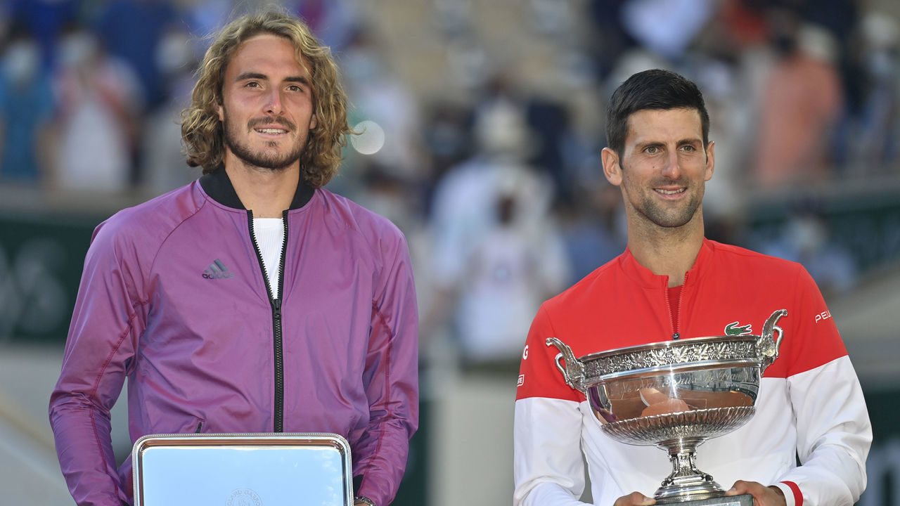 PARIS, FRANCE - JUNE 13: Winner Novak Djokovic of Serbia (R) and runner up Stefanos Tsitsipas (L) of Greece pose with trophy after their Men's final match at the French Open tennis tournament at Roland Garros in Paris, France on June 13, 2021.