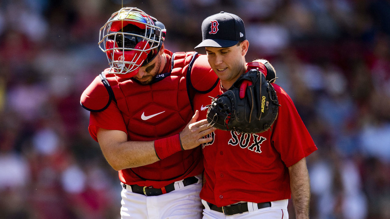 BOSTON, MA - JUNE 13: Kevin Plawecki #25 reacts with Ryan Weber #65 of the Boston Red Sox during the seventh inning of a game against the Toronto Blue Jays on June 13, 2021 at Fenway Park in Boston, Massachusetts.