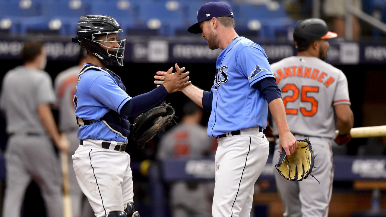 ST PETERSBURG, FLORIDA - JUNE 13: Jeffrey Springs #59 and Francisco Mejia #28 of the Tampa Bay Rays celebrate after defeating the Baltimore Orioles by a score of 7 to 1 at Tropicana Field on June 13, 2021 in St Petersburg, Florida.