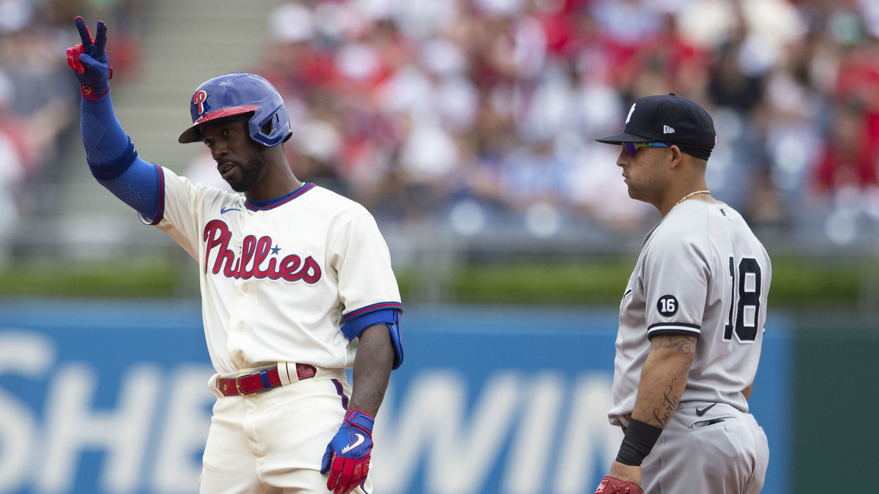 PHILADELPHIA, PA - JUNE 13: Andrew McCutchen #22 of the Philadelphia Phillies reacts in front of Rougned Odor #18 of the New York Yankees after a double in the bottom of the second inning at Citizens Bank Park on June 13, 2021 in Philadelphia, Pennsylvania. The Phillies defeated the Yankees 7-0.
