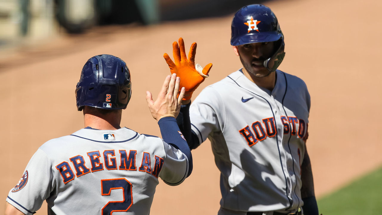 MINNEAPOLIS, MN - JUNE 13: Carlos Correa #1 celebrates with Alex Bregman #2 after Bregman scored a run off a sacrifice fly by Robel Garcia of the Houston Astros in the ninth inning of the game against the Minnesota Twins at Target Field on June 13, 2021 in Minneapolis, Minnesota. The Astros defeated the Twins 14-3.