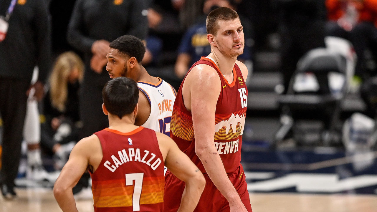 DENVER, CO - JUNE 13: Nikola Jokic #15 of the Denver Nuggets walks off the court after being ejected for a play involving Cameron Payne #15 of the Phoenix Suns in Game Four of the Western Conference second-round playoff series at Ball Arena on June 13, 2021 in Denver, Colorado.