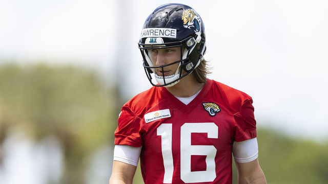 JACKSONVILLE, FLORIDA - JUNE 08: Trevor Lawrence #16 of the Jacksonville Jaguars looks on during Jacksonville Jaguars Training Camp at TIAA Bank Field on June 08, 2021 in Jacksonville, Florida.