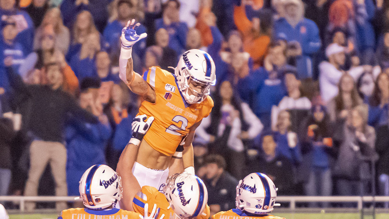 BOISE, ID - OCTOBER 12: Boise State Broncos wide receiver Khalil Shakir (2) gets a celebration lift from Boise State Broncos offensive lineman John Molchon (77) after scoring during the game between the Hawaii Warriors and Boise State Broncos on Saturday, October 12, 2019, at Albertson's Stadium in Boise, Idaho.