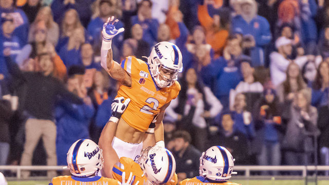 BOISE, ID - OCTOBER 12: Boise State Broncos wide receiver Khalil Shakir (2) gets a celebration lift from Boise State Broncos offensive lineman John Molchon (77) after scoring during the game between the Hawaii Warriors and Boise State Broncos on Saturday, October 12, 2019, at Albertson's Stadium in Boise, Idaho.