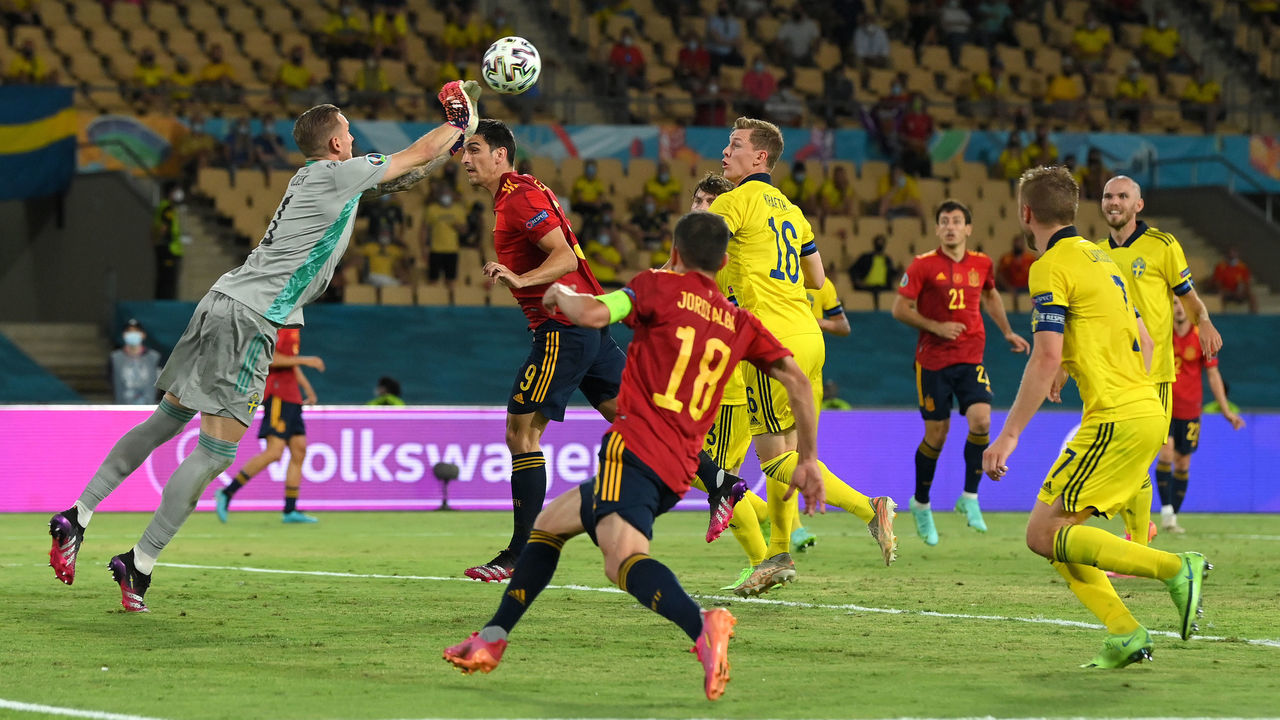 SEVILLE, SPAIN - JUNE 14: Robin Olsen of Sweden claims the ball whilst under pressure from Gerard Moreno of Spain during the UEFA Euro 2020 Championship Group E match between Spain and Sweden at the La Cartuja Stadium on June 14, 2021 in Seville, Spain.