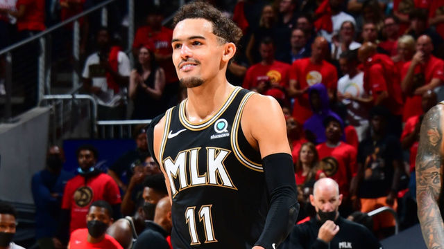 ATLANTA, GA - JUNE 14: Trae Young #11 of the Atlanta Hawks smiles during Round 2, Game 4 of the 2021 NBA Playoffs on June 14, 2021 at State Farm Arena in Atlanta, Georgia. NOTE TO USER: User expressly acknowledges and agrees that, by downloading and/or using this Photograph, user is consenting to the terms and conditions of the Getty Images License Agreement. Mandatory Copyright Notice: Copyright 2021 NBAE