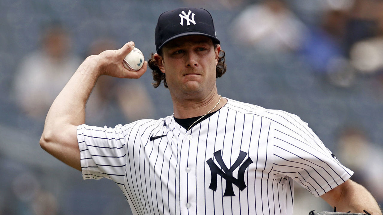 NEW YORK, NY - JUNE 3: Gerrit Cole #45 of the New York Yankees throws to first base against the Tampa Bay Rays during the first inning at Yankee Stadium on June 3, 2021 in the Bronx borough of New York City.