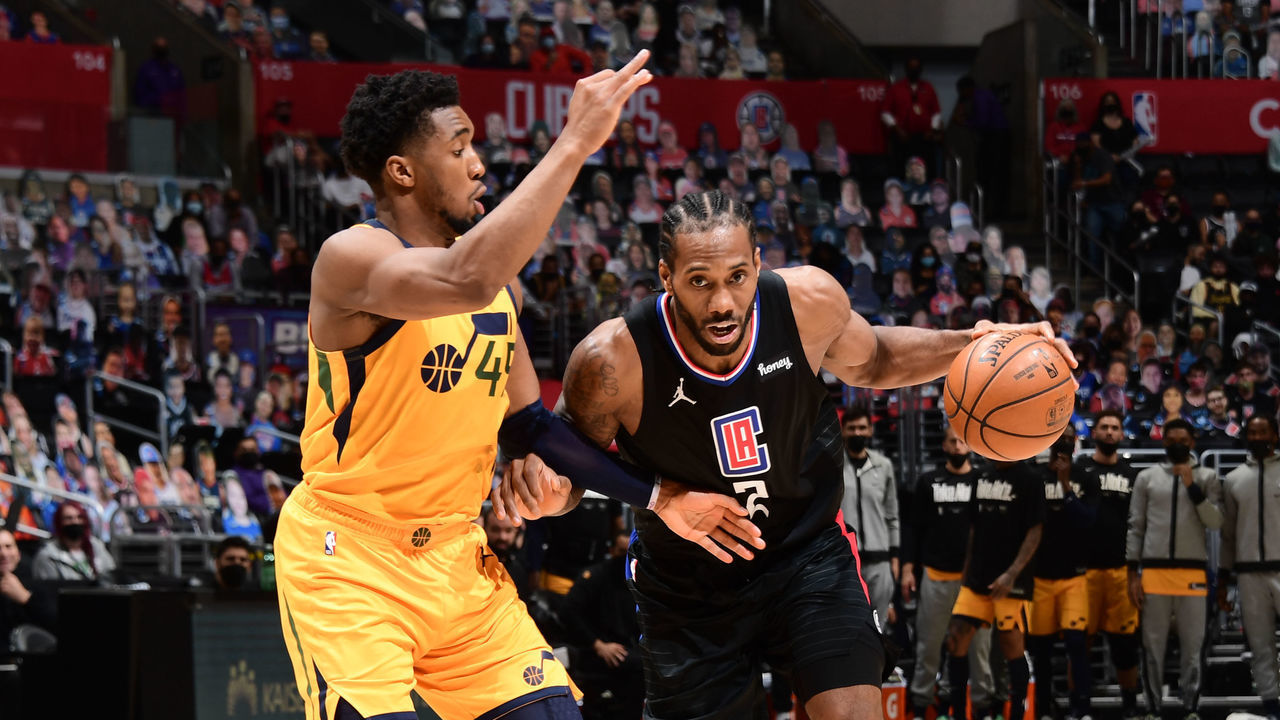 LOS ANGELES, CA - JUNE 14: Donovan Mitchell #45 of the Utah Jazz plays defense on Kawhi Leonard #2 of the LA Clippers during Round 2, Game 4 of 2021 NBA Playoffs on June 14, 2021 at STAPLES Center in Los Angeles, California. NOTE TO USER: User expressly acknowledges and agrees that, by downloading and/or using this Photograph, user is consenting to the terms and conditions of the Getty Images License Agreement. Mandatory Copyright Notice: Copyright 2021 NBAE