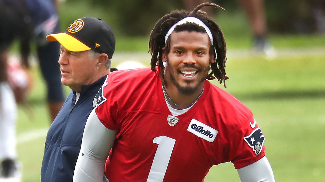 Foxborough, MA - June 4: Quarterback Cam Newton warms up as coach Bill Belichick walks by. The New England Patriots held OTAs (Organized Team Activities) at their practice field at Gillette Stadium in Foxborough, MA on June 4, 2021.