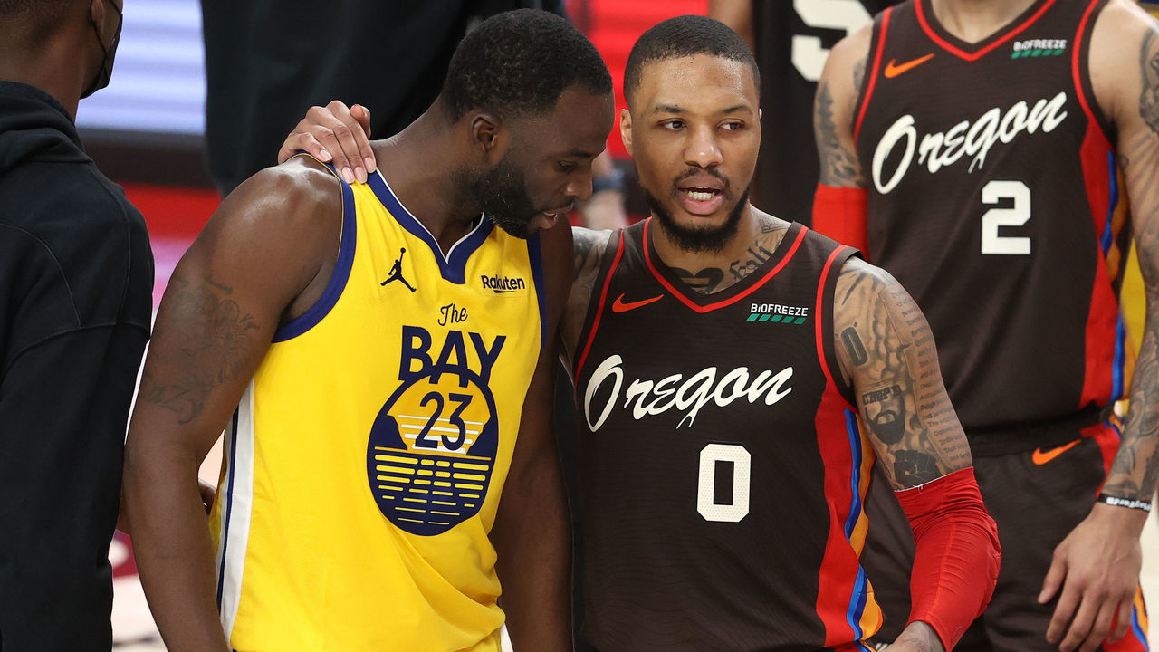 PORTLAND, OREGON - MARCH 03: Draymond Green #23 of the Golden State Warriors and Damian Lillard #0 of the Portland Trail Blazers have a conversation after the Portland Trail Blazers defeated the Golden State Warriors 108-106 at Moda Center on March 03, 2021 in Portland, Oregon.