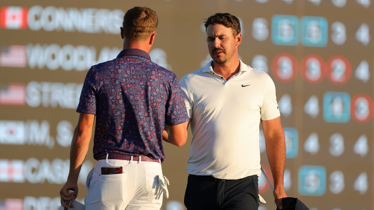 KIAWAH ISLAND, SOUTH CAROLINA - MAY 21: (L-R) Justin Thomas of the United States and Brooks Koepka of the United States shake hands on the 18th green during the second round of the 2021 PGA Championship at Kiawah Island Resort's Ocean Course on May 21, 2021 in Kiawah Island, South Carolina.